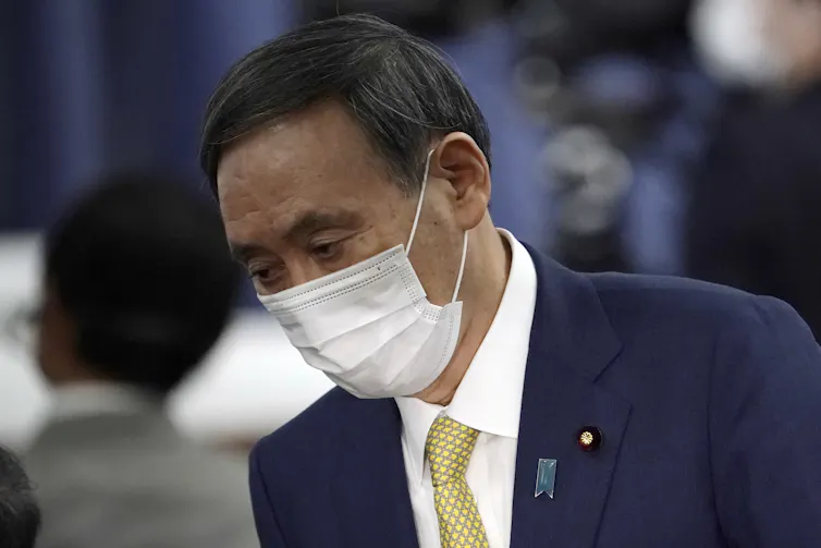 Yoshihide Suga wearing a face mask.