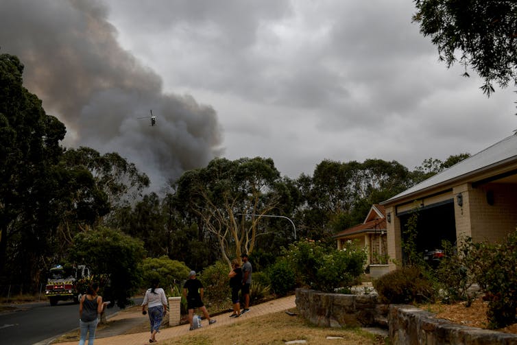 Water bomber puts out a blaze from the sky.