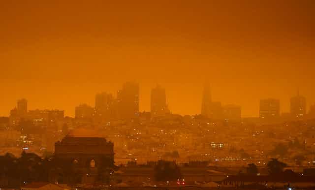 An orange haze settles over the San Francisco skyline.