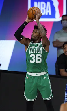 A basketball player shooting the ball.
