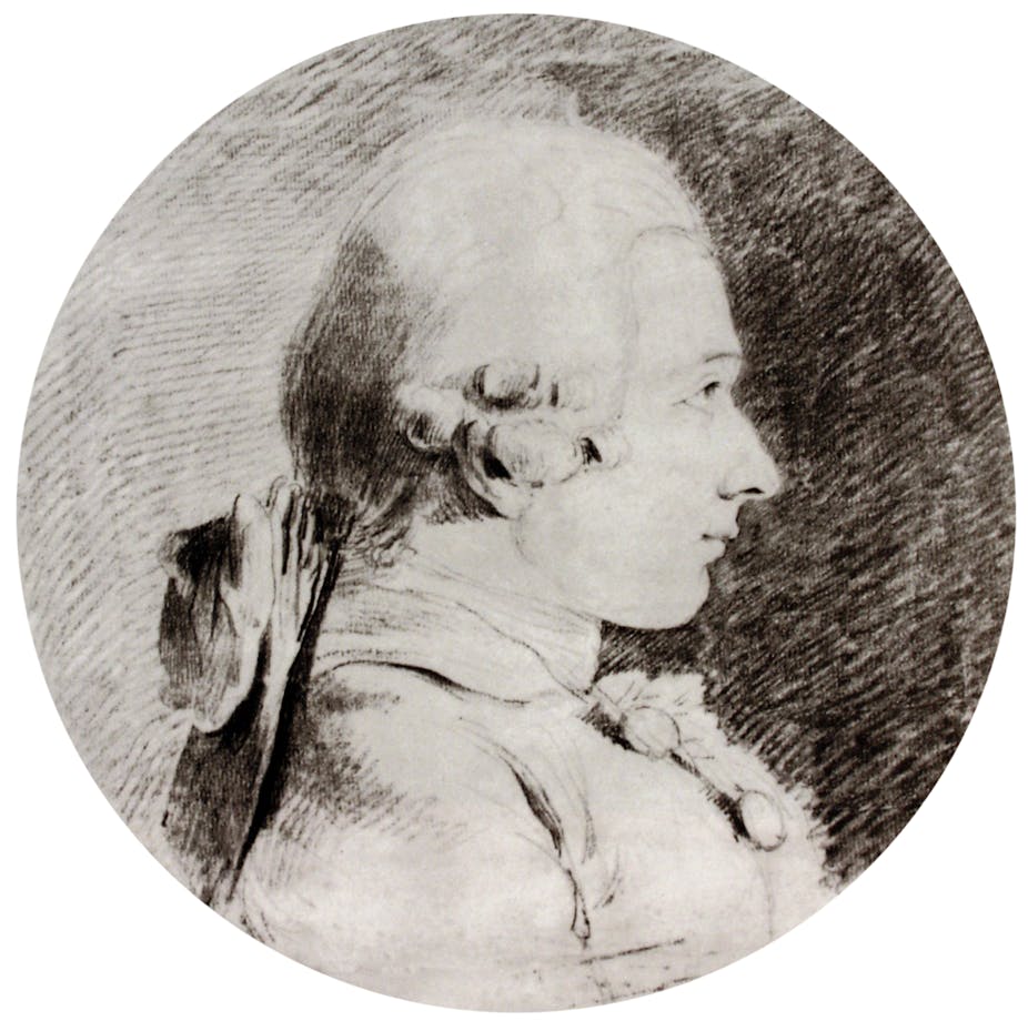 Profile portrait of young man in 18th-century wig.