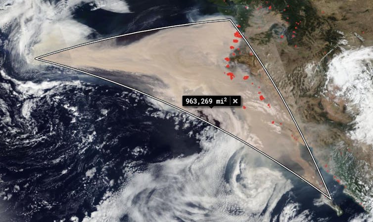 Brown smoke spreads over the Pacific from U.S. west coast.