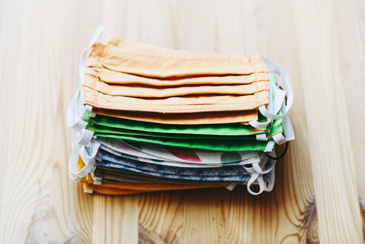 A stack of colourful cloth masks