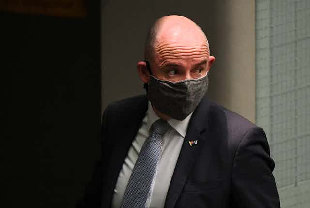 Federal Minister for Government Services Stuart Roberts wearing a mask.