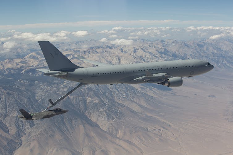 KC-30 Tanker flying over a mountain range.