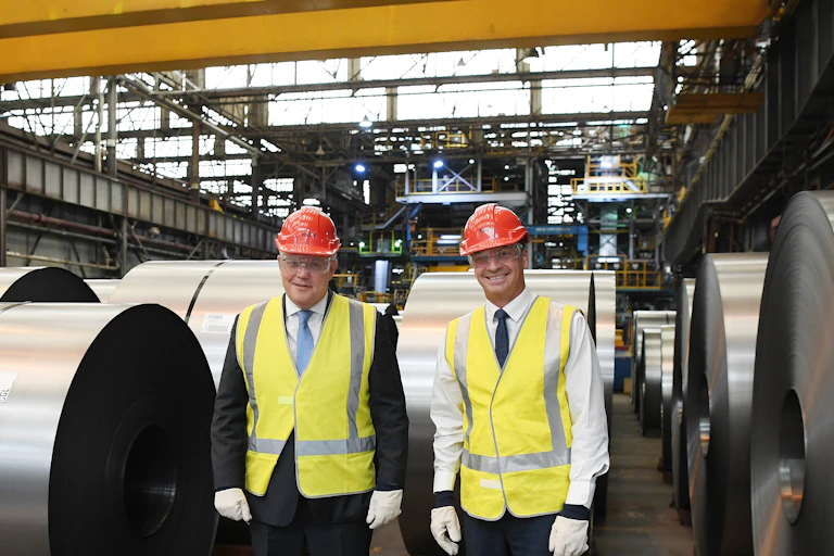 Scott Morrison and Angus Taylor wearing hi-vis and helmets