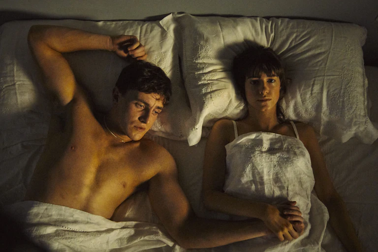 Man and woman in bed.