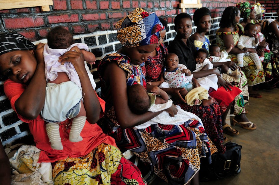 Women sitting in line with babies