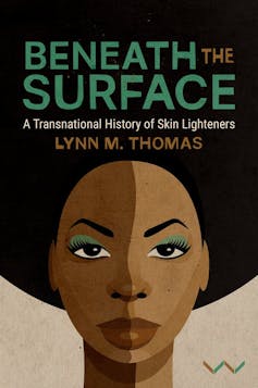 Book cover with words 'Beneath the Surface' and an illustration of a woman with an Afro hairstyle, a shadow across her face dividing it into dark brown skin tone and light brown.