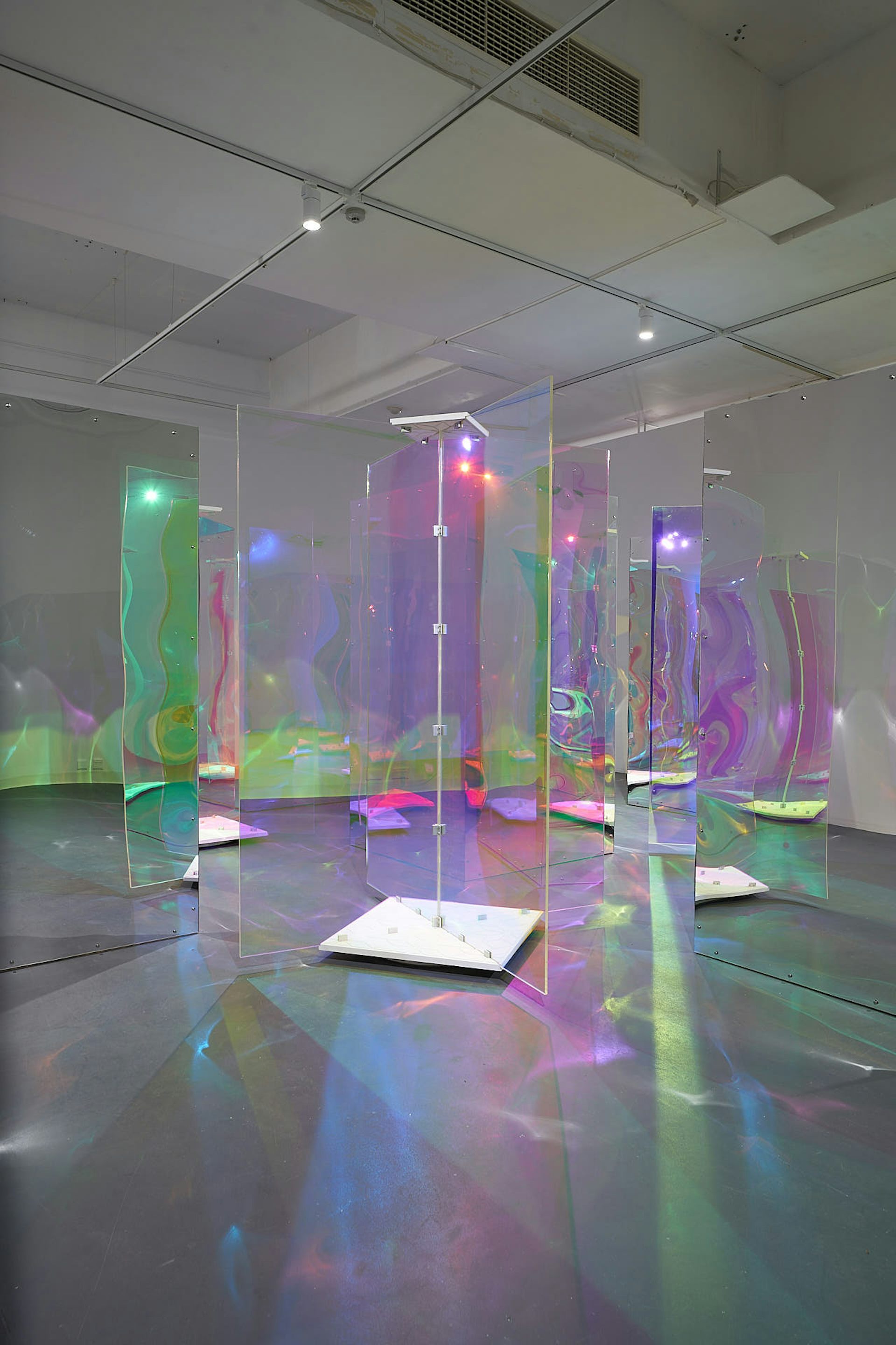 A room filled with glowing perspex doors