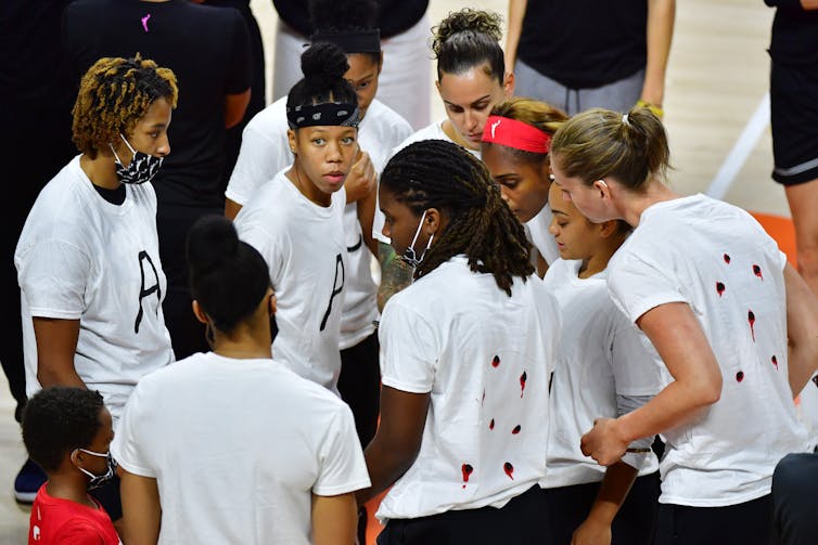 young women on basketball court