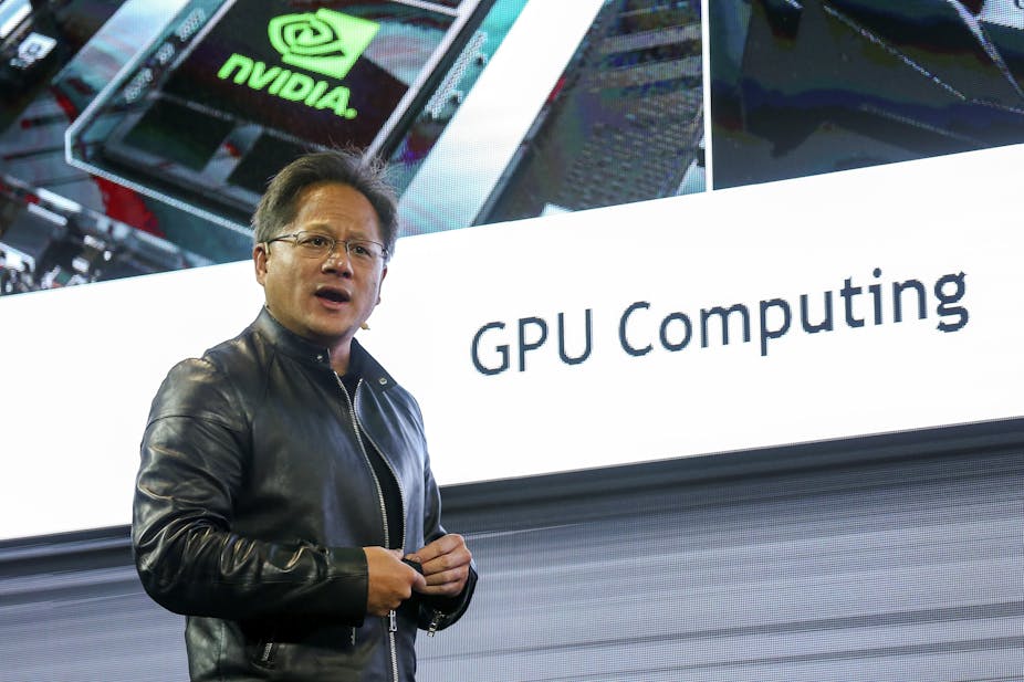 Nvidia CEO Jensen Huang stood in front of large screen.