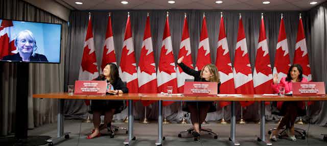 Chrystia Freeland is seen with three other women cabinet ministers at a news conference.
