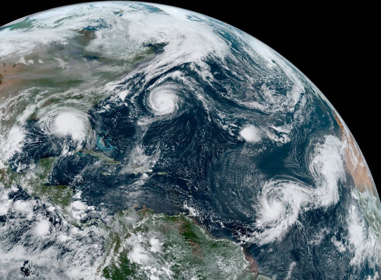Satellite image of five tropical storms.