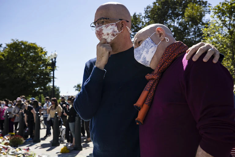 Michael Widomski (L) and David Hagedorn (R) at the makeshift memorial for Justice Ginsburg in front of the US Supreme Court.