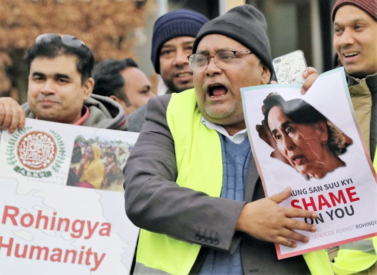 Critics protested against Myanmar leader Aung San Suu Kyi outside the International Court of Justice in The Hague, during a case brought by Gambia alleging Myanmar has committed genocide against the Rohingya Muslim minority.