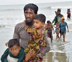 Rohingya refugees arriving by boat near Cox's Bazar, Bangladesh in 2017.