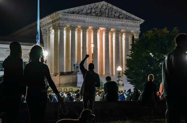 People gather outside the U.S. Supreme Court building