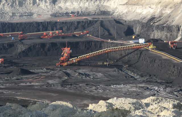 Large coal pit with excavating machinery