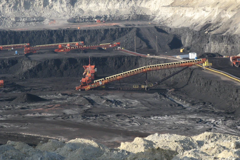 Large coal pit with excavating machinery