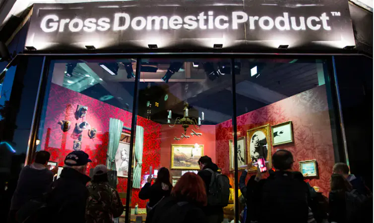 Image of Gross Domestic Product a shop window in Croydon showing graffiti artist Banksy's merchandise.
