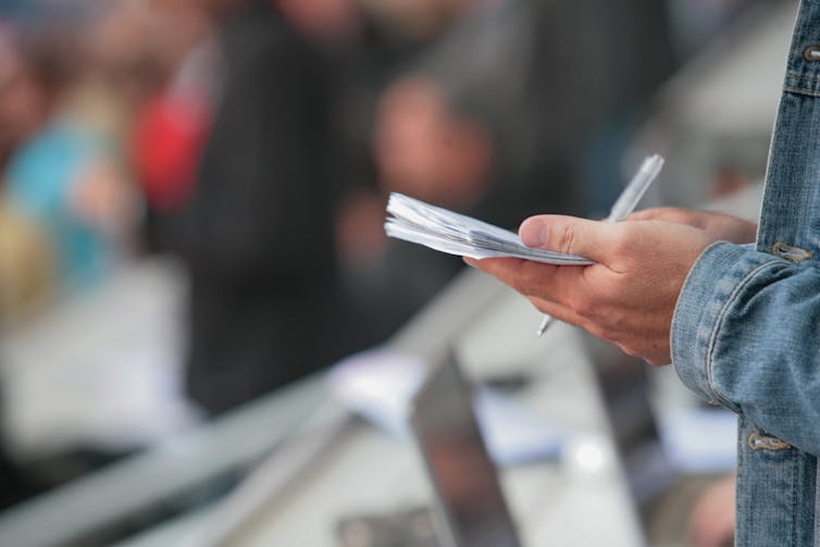 A reporter taking notes.