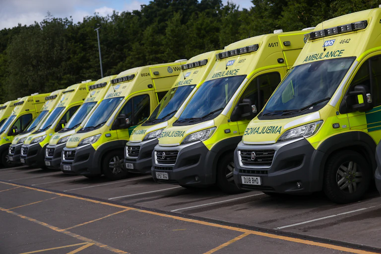 A row of parked ambulances