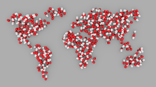 Red and white drug capsules arranged in the shape of the continents to form a map of the world.