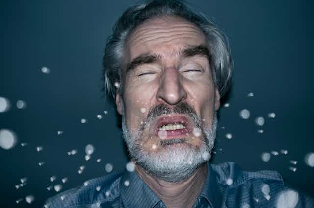 Illustration of a man sneezing