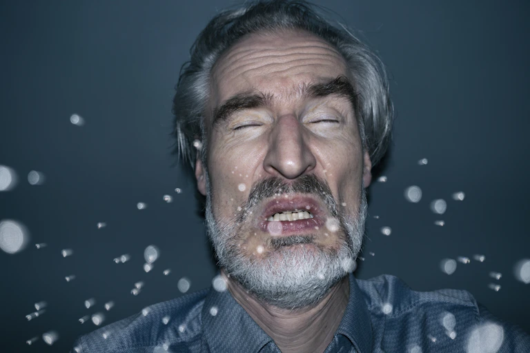 Illustration of a man sneezing