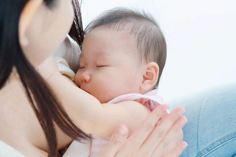 Baby suckling at breast