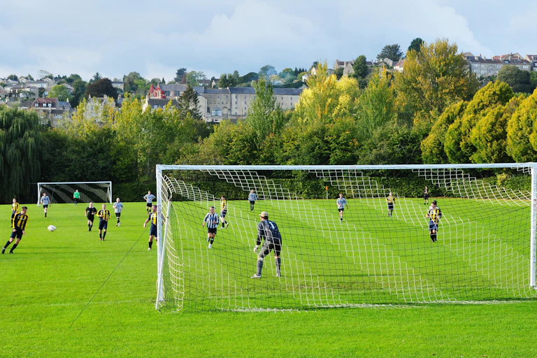 Amateur football match in progress.