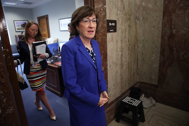 Sen. Susan Collins in a marine blue suit.