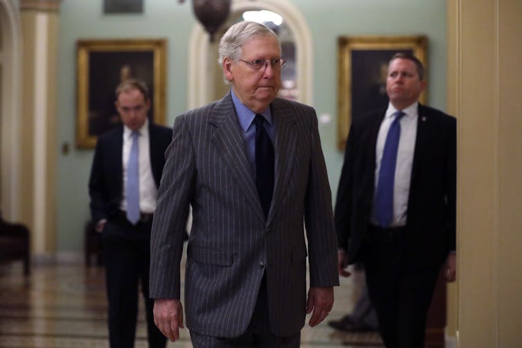 Senate Majority Leader Mitch McConnell, walking into a meeting.