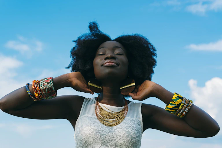 Woman smiling and looking content.