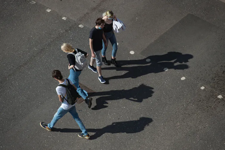 An aerial view of students walking in different directions.