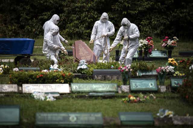 Funeral service a victim of the COVID-19 pandemic, at the Parque Taruma graveyard, in Manaus, Brazil
