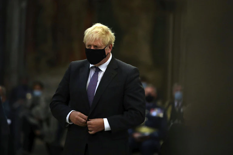 Boris Johnson wearing a mask