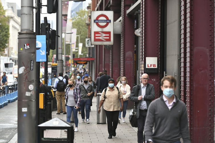 Pedestrians outside Waterloo Station in London