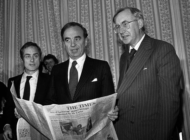 Harold Evans, Sunday Times Editor; New owner and Australian press magnate Rupert Murdoch and William Rees-Mogg, The Times Editor.