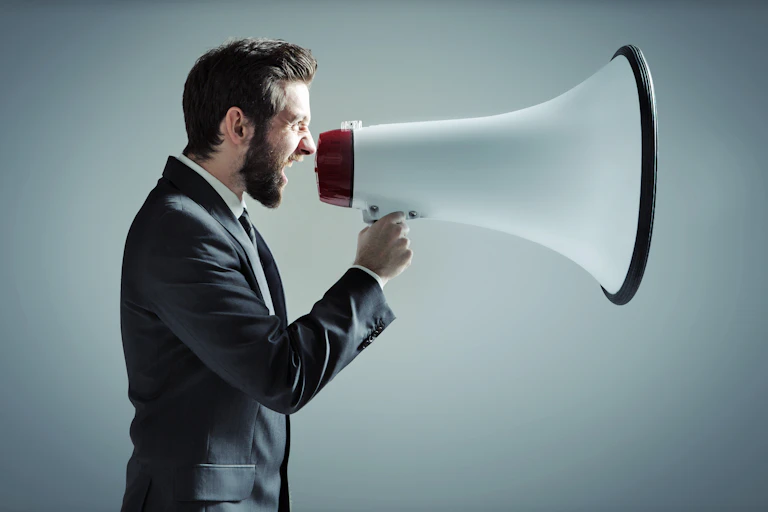 Man shouts into massive megaphone