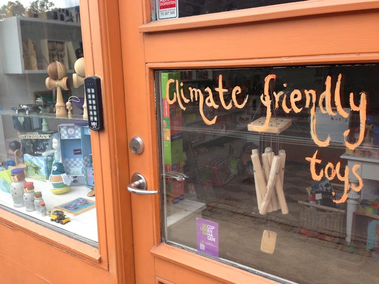 A shop with the words climate friendly toys written on the door.