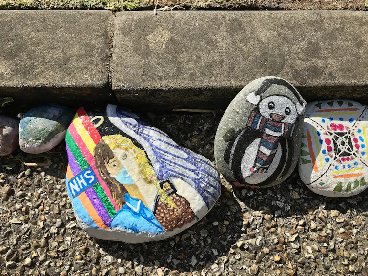 Colourful designs painted on pebbles