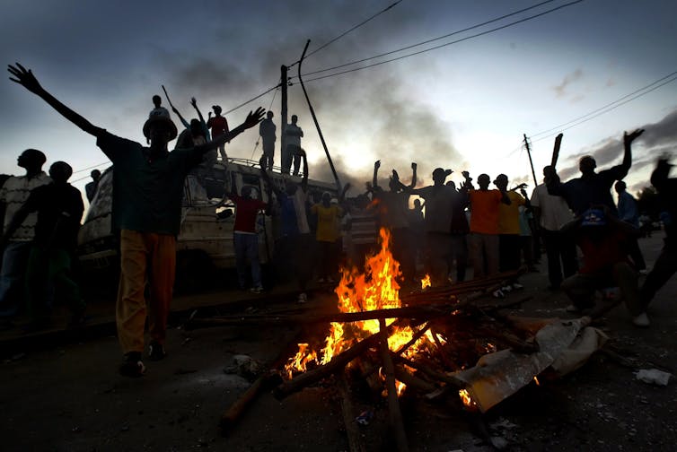 Protesters around a bonfire