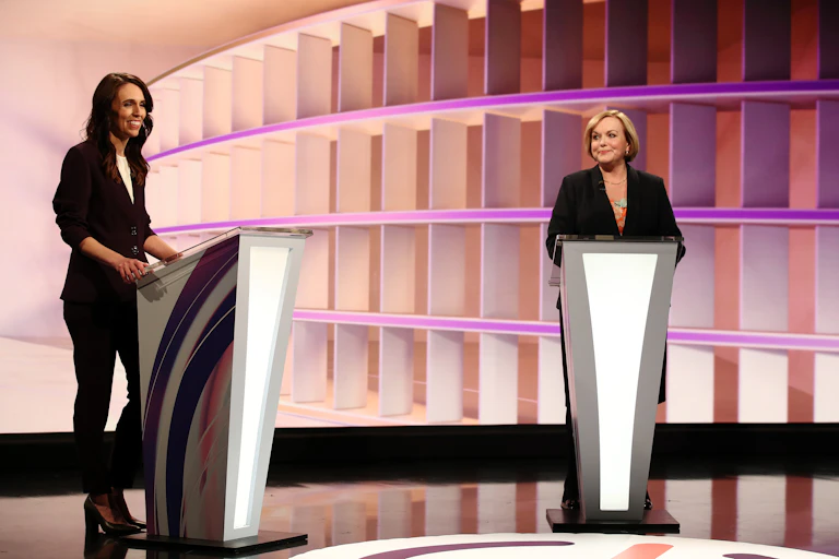 two woman at podiums