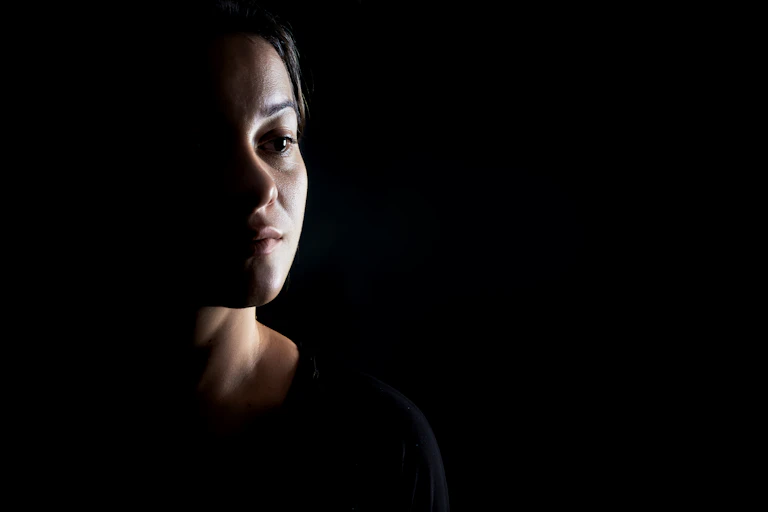 Portrait of a woman surrounded by shadow