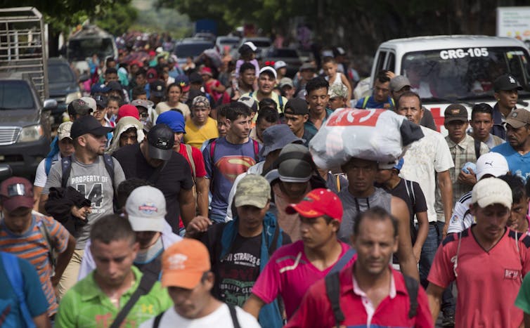 A large crowd on people walking.