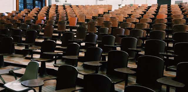 Lecture hall with empty desks.