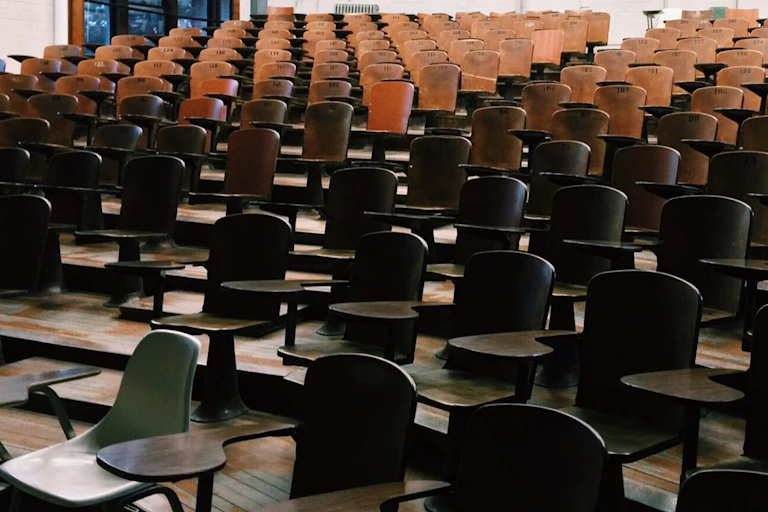 Lecture hall with empty desks.