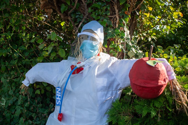 Scarecrow dressed as an NHS worker